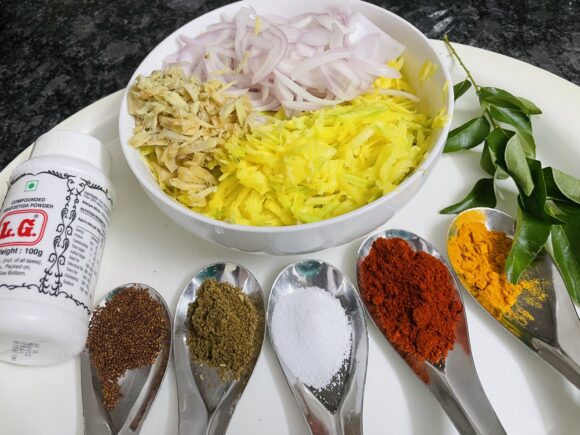 Grate Raw Mango (Kairi) and Slice onion and ginger,