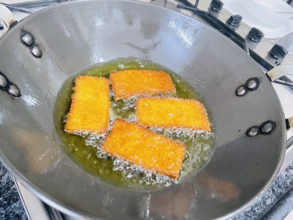deep fry bread on medium high flame until golden brown in colour on both sides