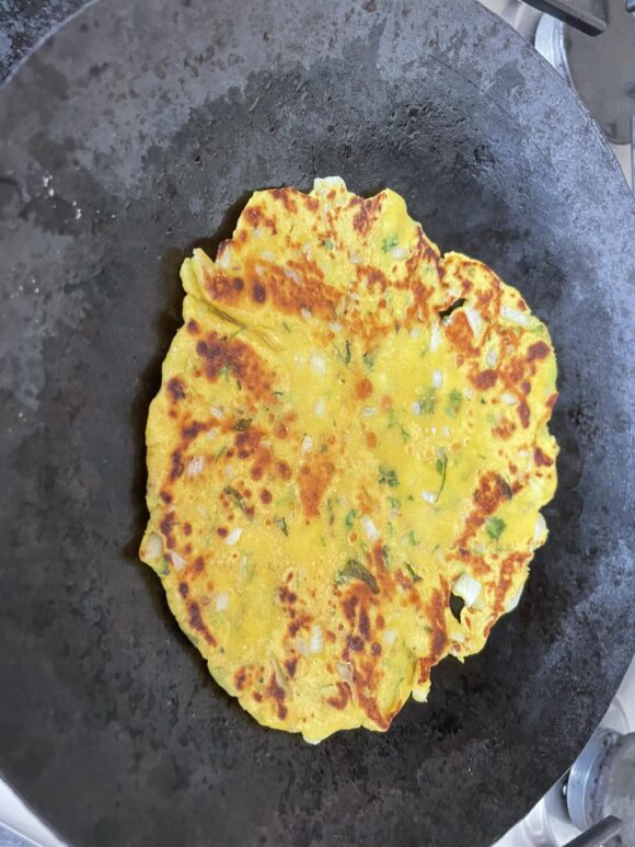 place the rolled Dhapate on griddle.